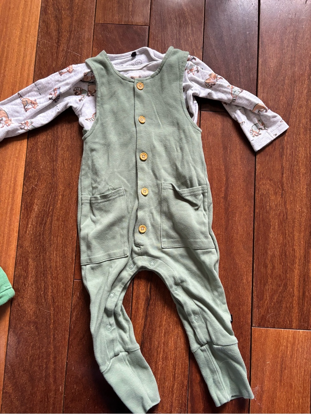 Green Baby Romper with Wooden Buttons and long sleeve body suit with racoons
